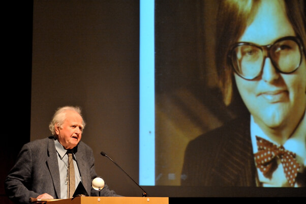 Malachy McCourt speaks against the backdrop of an image of Dougie. | DONNA ACETO