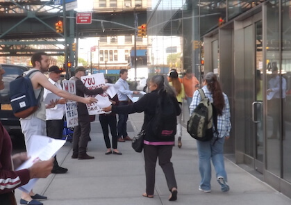 Members of ACT UP New York flyer outside a health department office in Queens on May 13.n | GAY CITY NEWS