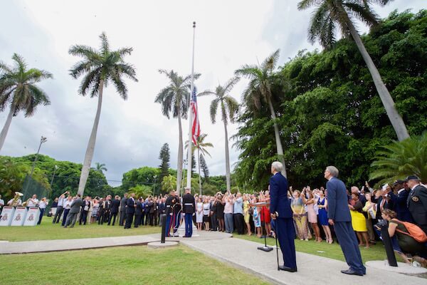Secretary of State John Kerry and Jeffrey DeLaurentis, the State Department’s chargé d'affaires in Cuba, raising the American flag in Havana. | US STATE DEPARTMENT