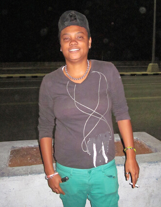 Sadia, a lesbian outside the Fiat Cafe, a gay hangout across from the Malecón, the broad esplanade that makes up the sea wall in Havana. | DONNA ACETO