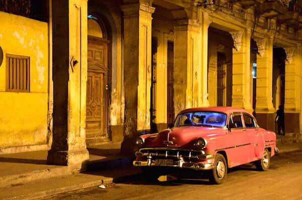 Old American cars, this one seen at dawn, are fixed using any metal that can be found. | DONNA ACETO