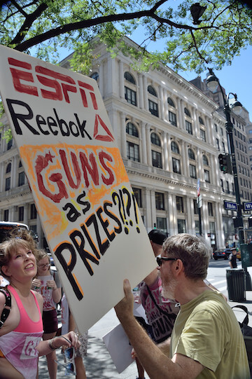 Protesters also noted the role of the Games’ sponsor Reebok and broadcaster ESPN. | DONNA ACETO