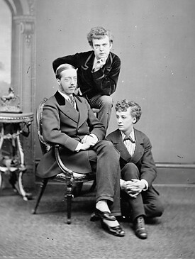 Fanny (standing) and Stella (front) with Lord Arthur Pelham-Clinton. | FABER & FABER 