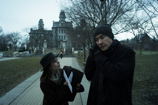 Emma Roberts fawning over John Cusack in Scott Coffey’s “Adult World.” | IFC FILMS  