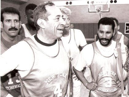 Governor Andrew Cuomo plays basketball during the 1994 Gay Games with hate crimes bill activist Howie Katz (l.) and Senator David Paterson, the leader of hate crimes efforts in the Legislature who himself went on to become governor. | COURTESY: HOWIE KATZ 