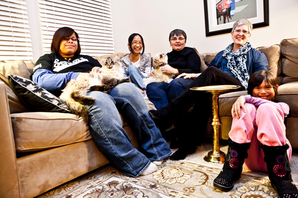 Sally and Susan Waters, with Kayla, for whom they are legal guardians, and their daughters, Ella and Jaden. | COURTESY: JASON McCLAREN