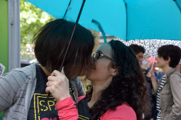 An intimate moment amidst the roar. | DONNA ACETO