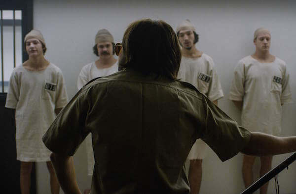 Four “inmates” and one “guard” in Kyle Patrick Alvarez’s “The Stanford Prison Experiment.” | IFC FILMS 