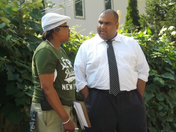 Ali Najmi (in white shirt) outside his Queens campaign headquarters on July on July 28. 