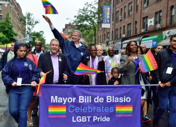 Mayor Bill de Blasio and wife Chirlane McCray are joined by Councilmembers Daniel Dromm and Jimmy Van Bramer and Public Advocate Letitia James.