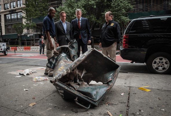 Governor Andrew Cuomo and Mayor Bill de Blasio inspect the rolling dumpster that was the point of origin for an explosion that shattered nerves in West Chelsea, at approximately 8:30 p.m. on Saturday evening. | MICHAEL APPLETON/ OFFICE OF THE MAYOR