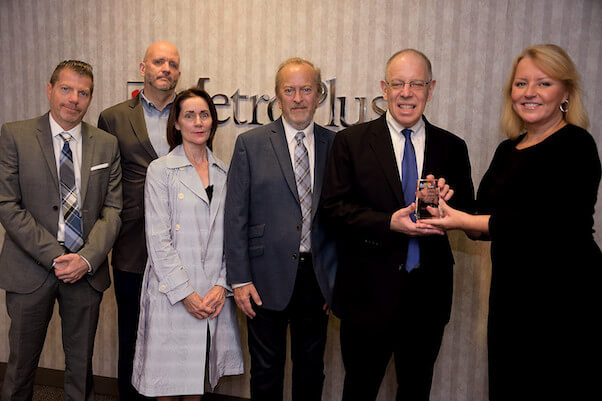At a September 22 event acknowledging MetroPlus winning an inaugural Ad POP Award, Gay City News publisher Jennifer Goodstein hands the honor to Seth Diamond, MetroPlus’ chief operating officer as (left to right) Paul Greenberg, managing partner at MSA Marketing, Gay City News editor Paul Schindler, MetroPlus’ director of corporate communications Kathryn Soman, and Keith Klein, chief creative officer at MSA Marketing, look on. | DONNA ACETO 