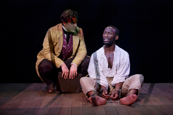 Nat Turner in Jerusalem NYTW By Nathan Alan Davis Directed by Megan Sandberg-Zakian Scenic Design by Susan Zeeman Rogers Costume Design by Montana Blanco Lighting Design by Mary Louise Geiger Sound Design by Nathan Leigh Fight Direction by Thomas Schall Dialect Coach Dawn-Elin Fraser Stage Manager Shelley Miles Featuring Phillip James Brannon and Rowan Vickers