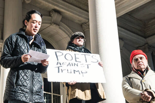 Maria de Los Angeles reads “Who Am I?” as poets Alan Kaufman and Tom Savage look on. | ALICE ESPINOSA-CINCOTTA