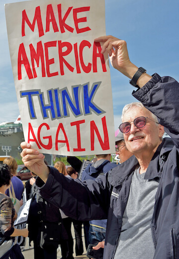 A protester near 44th and 12th Avenue. | DONNA ACETO