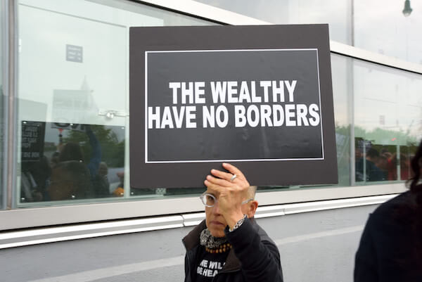 Another protester focused on the Trump administration’s tilt toward the wealthy. | DONNA ACETO